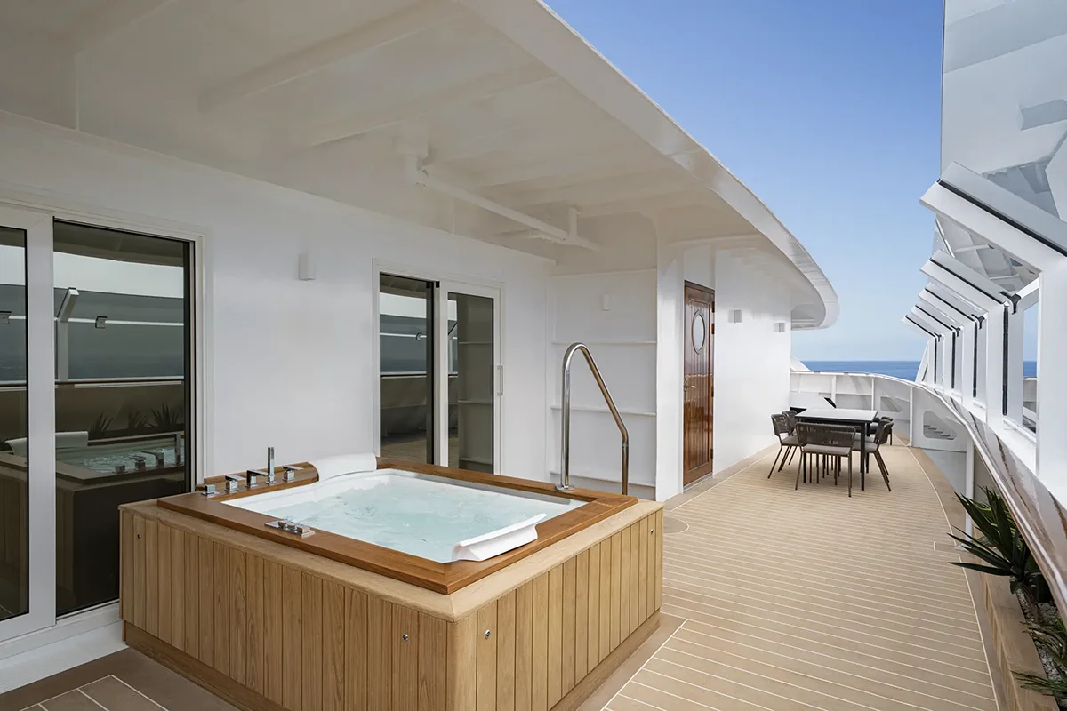 A balcony with a jacuzzi.